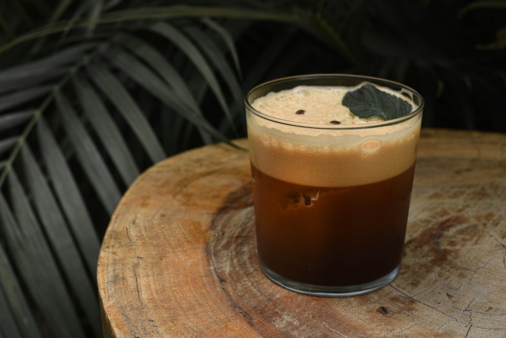 a drink sitting on top of a wooden table