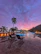 Inviting outdoor pool area at sunset with comfortable lounge chairs.