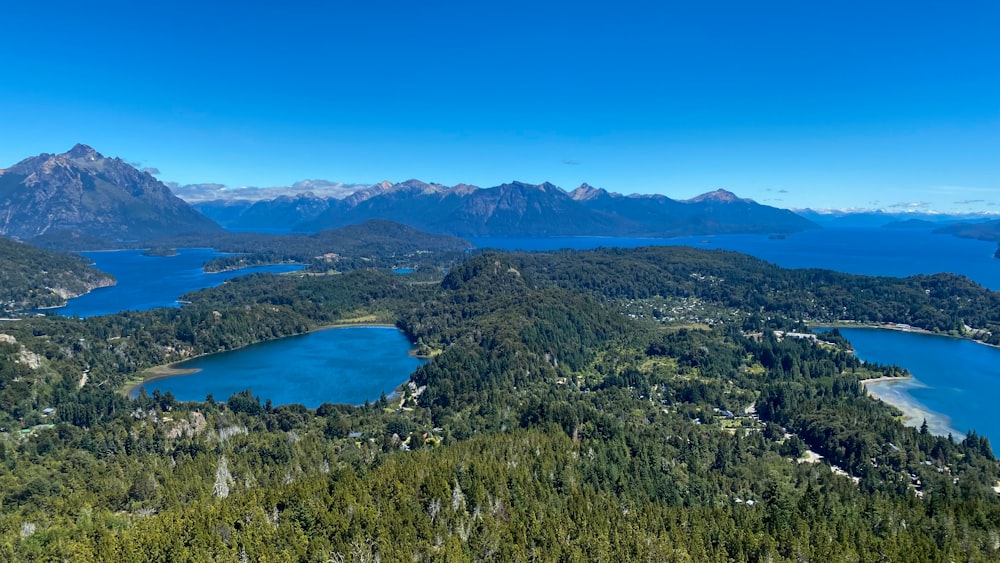 a scenic view of a lake surrounded by mountains