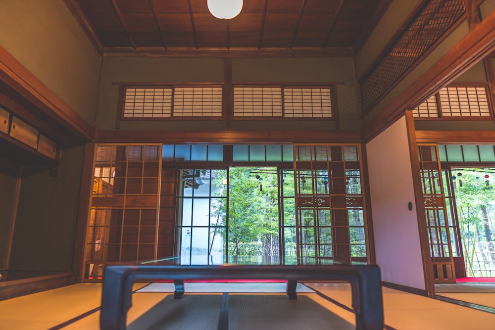 a room with a table and windows in it