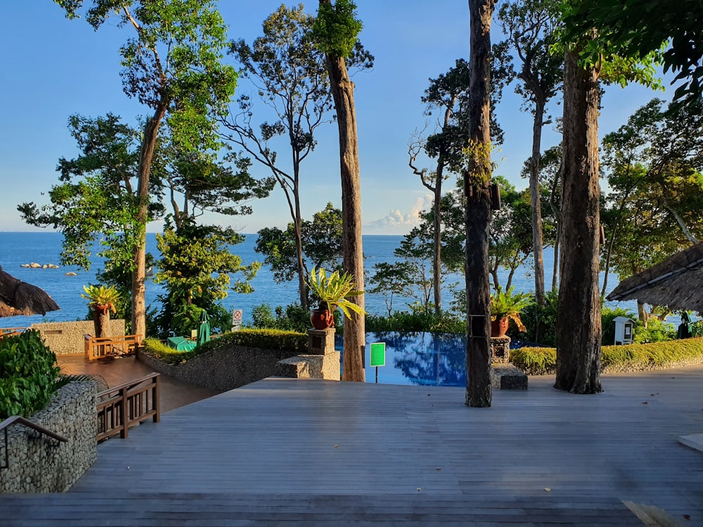 a wooden deck with a view of the ocean