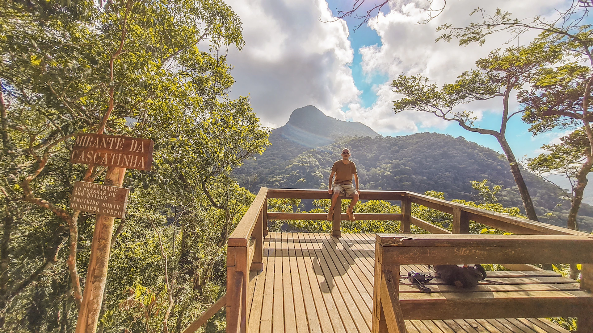 woman wearing yellow long-sleeved dress under white clouds and blue sky during daytime