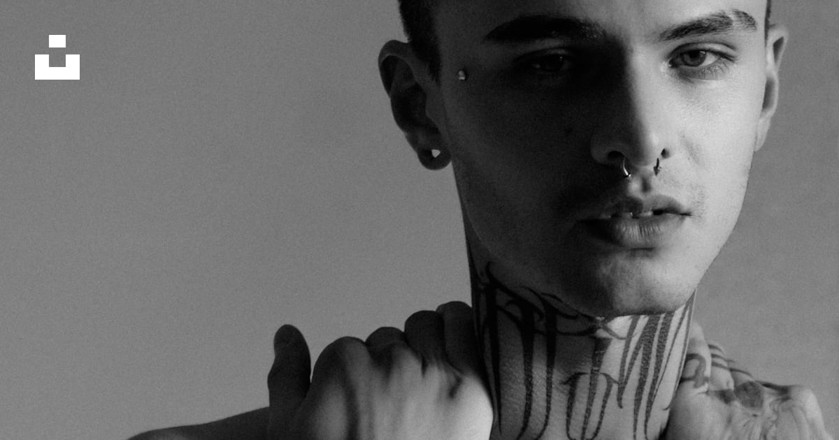 A man with a cat tattoo on his chest photo Free Tattoo Image on Unsplash