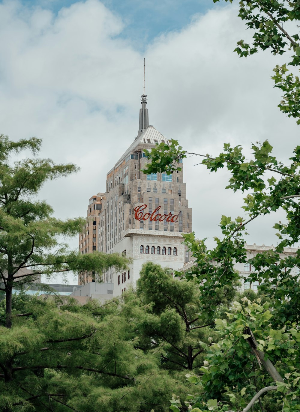 a tall building with a sign on top of it