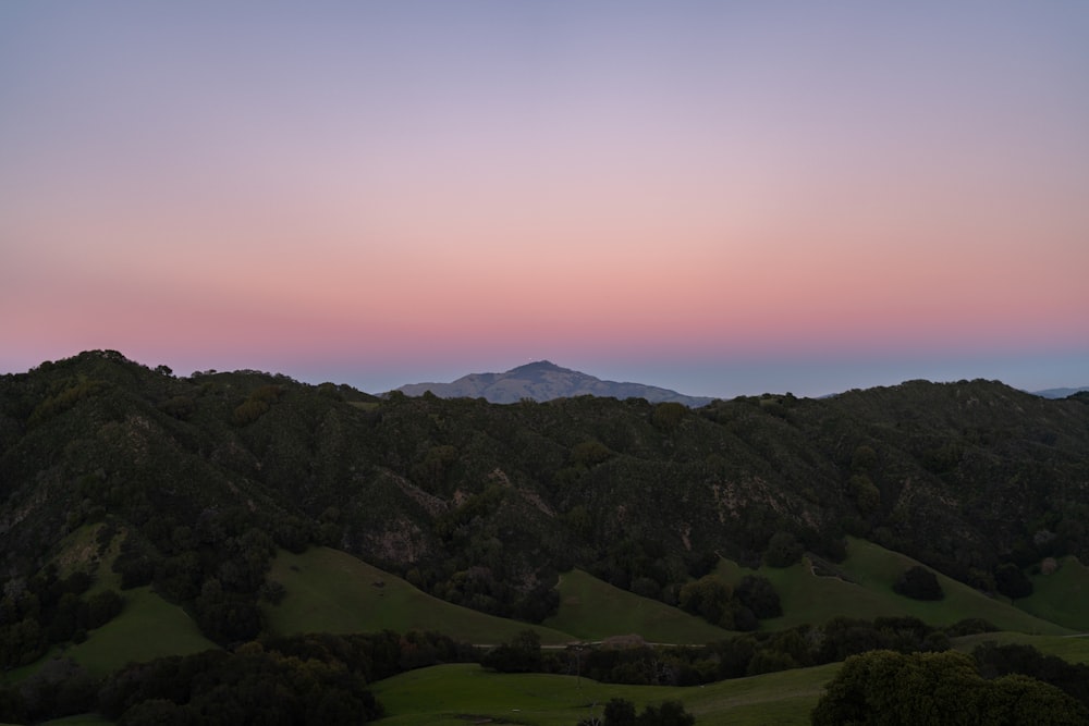 a view of a mountain range at sunset