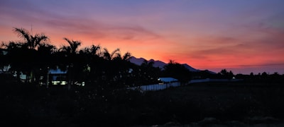 A stunning sunset over a beautifully staged home, showcasing the art of real estate photography.