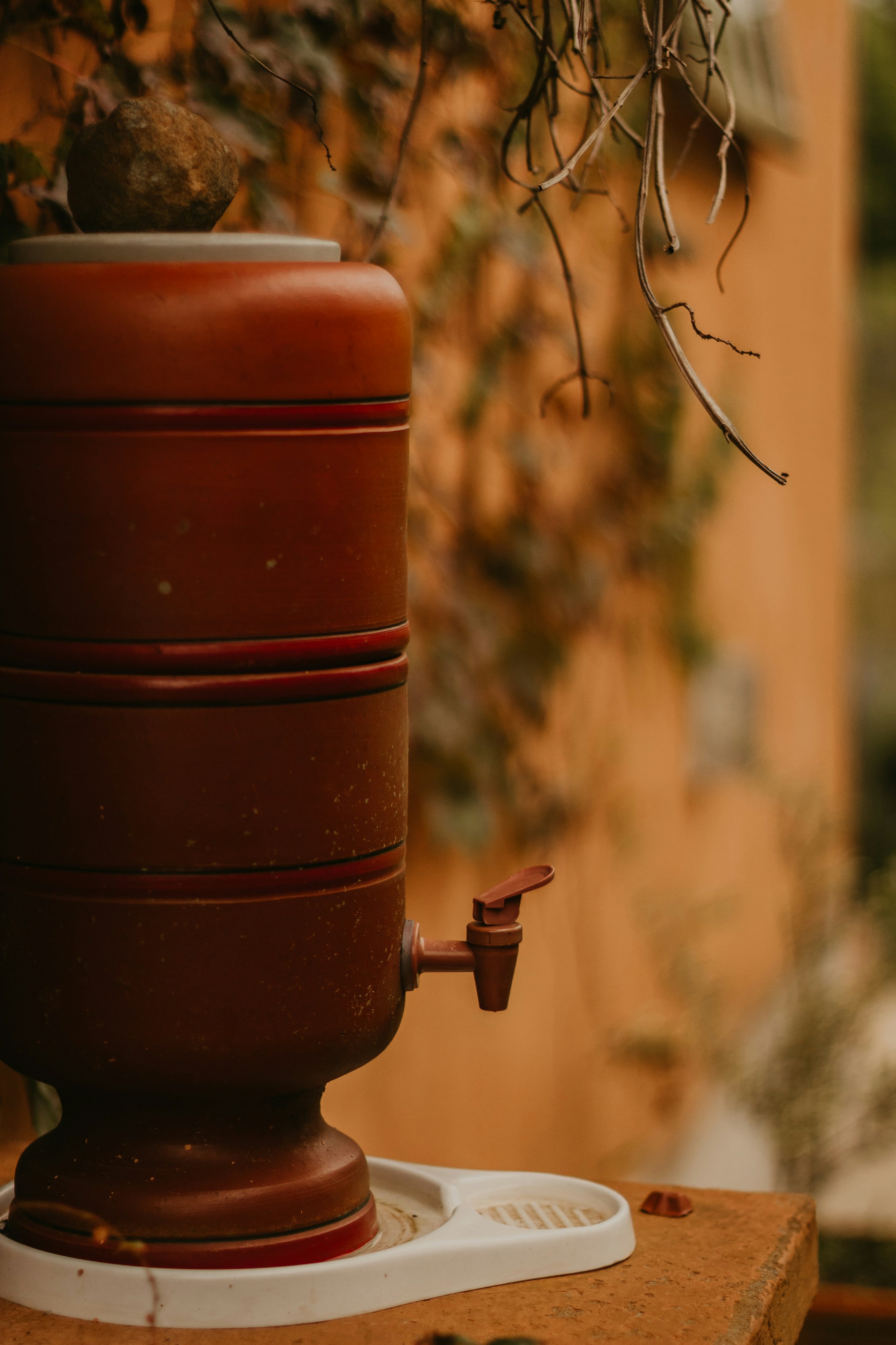 a close up of a coffee pot on a table