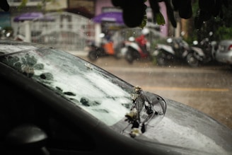 the windshield of a car with a bunch of bullet holes on it