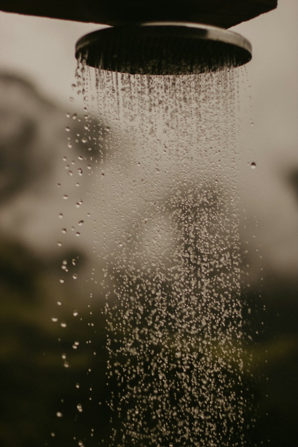 a shower head with water running down it