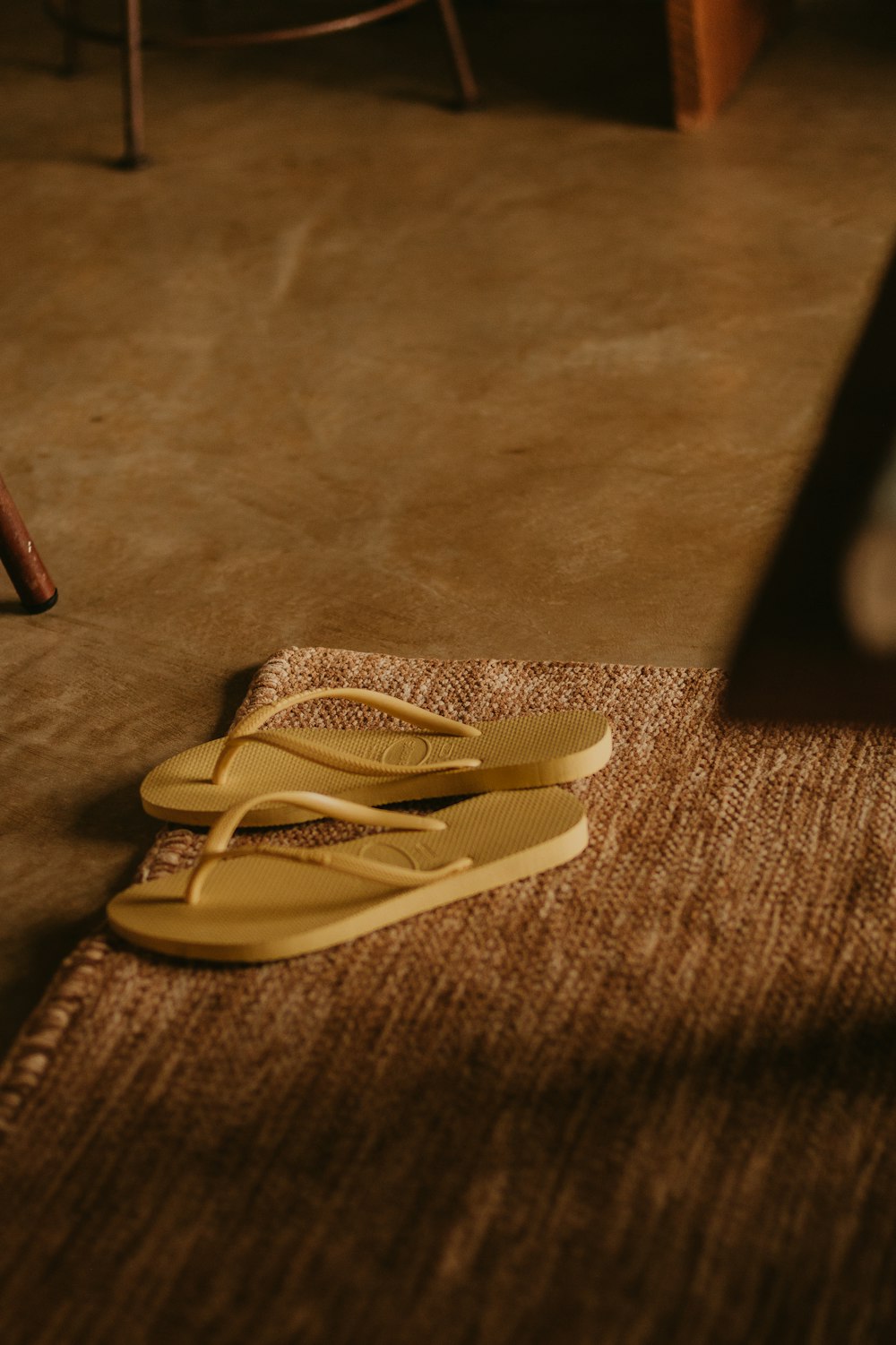 a pair of yellow scissors laying on the floor