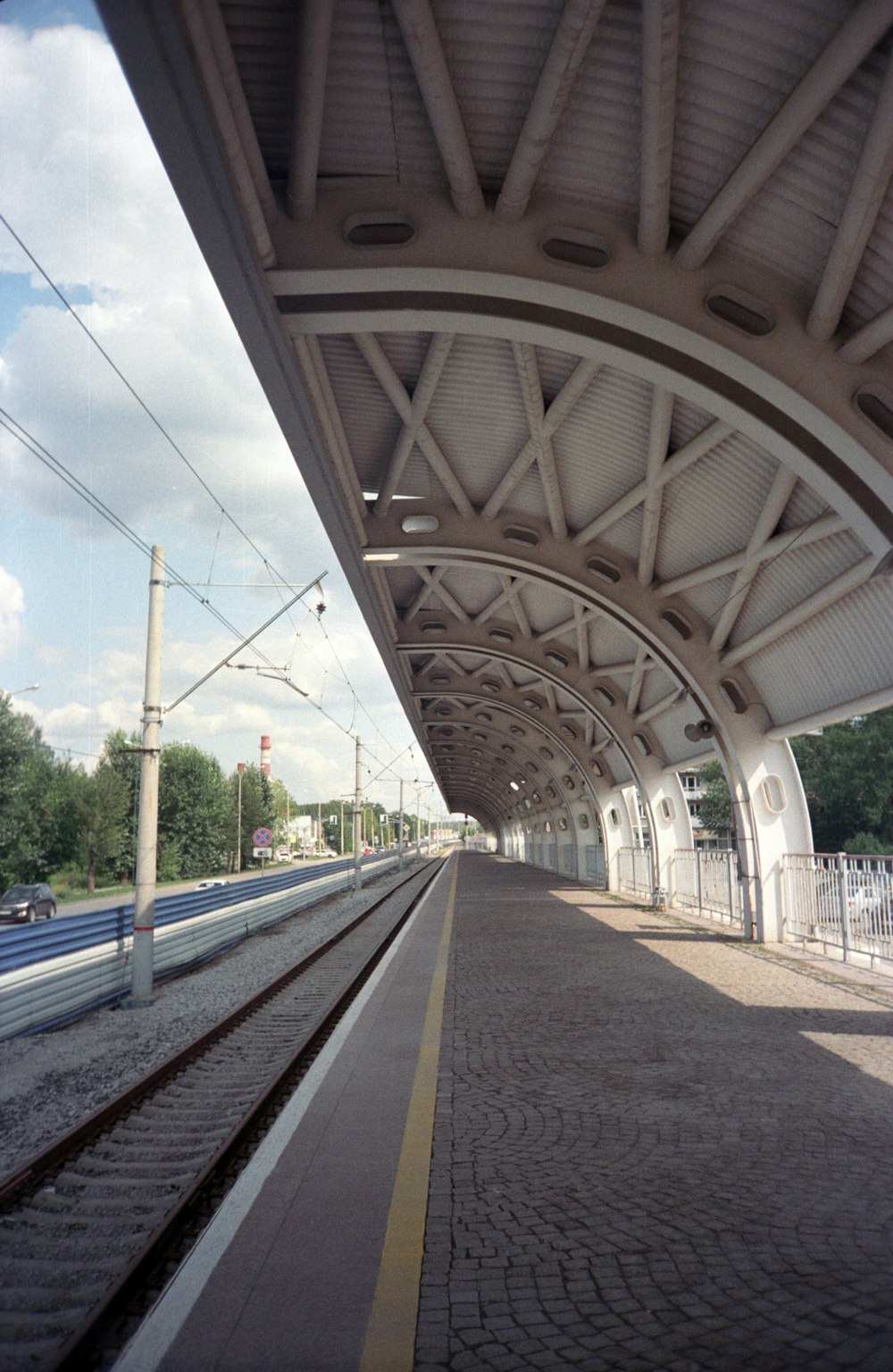 a train station with a train on the tracks