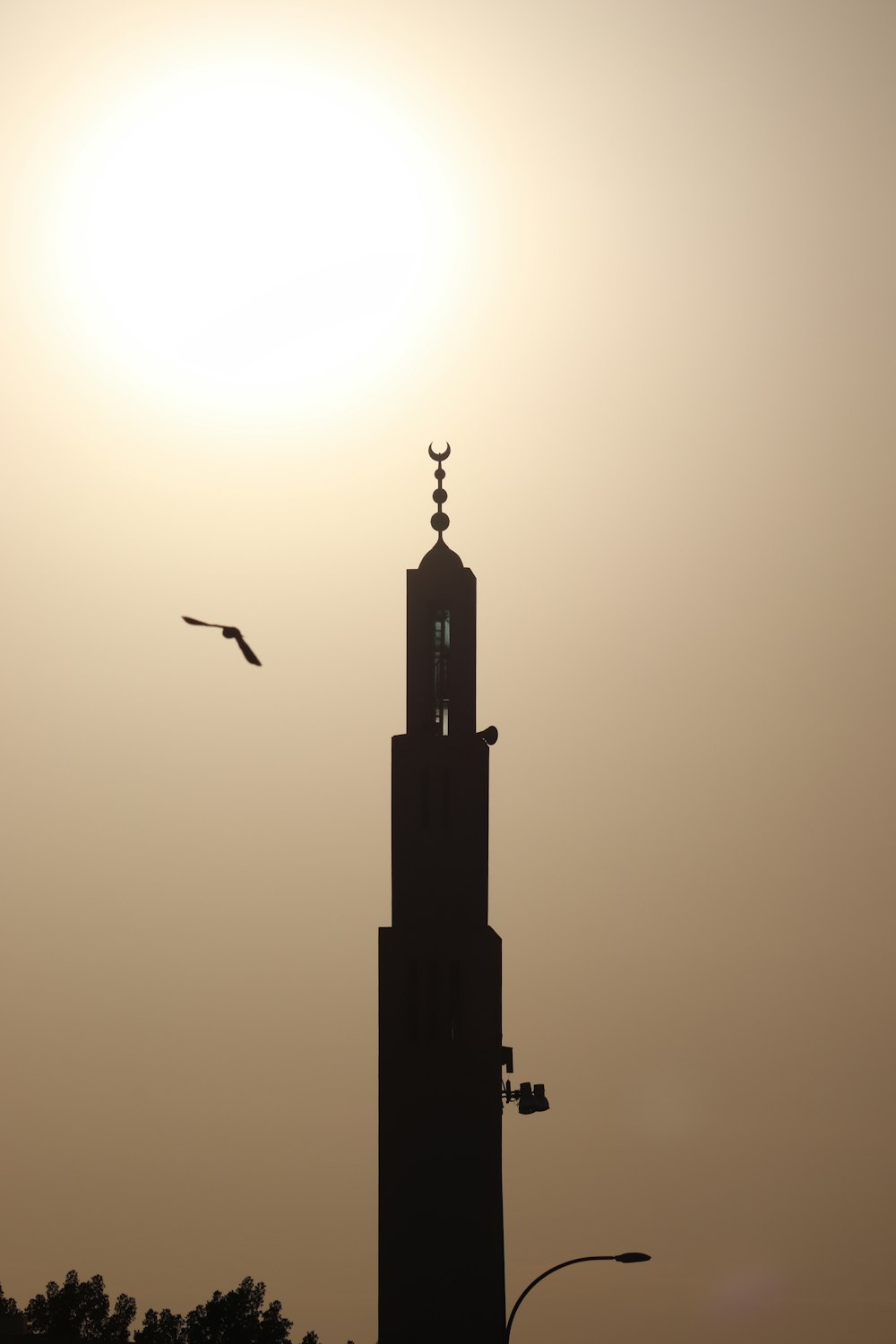 a tall tower with a clock on the top of it