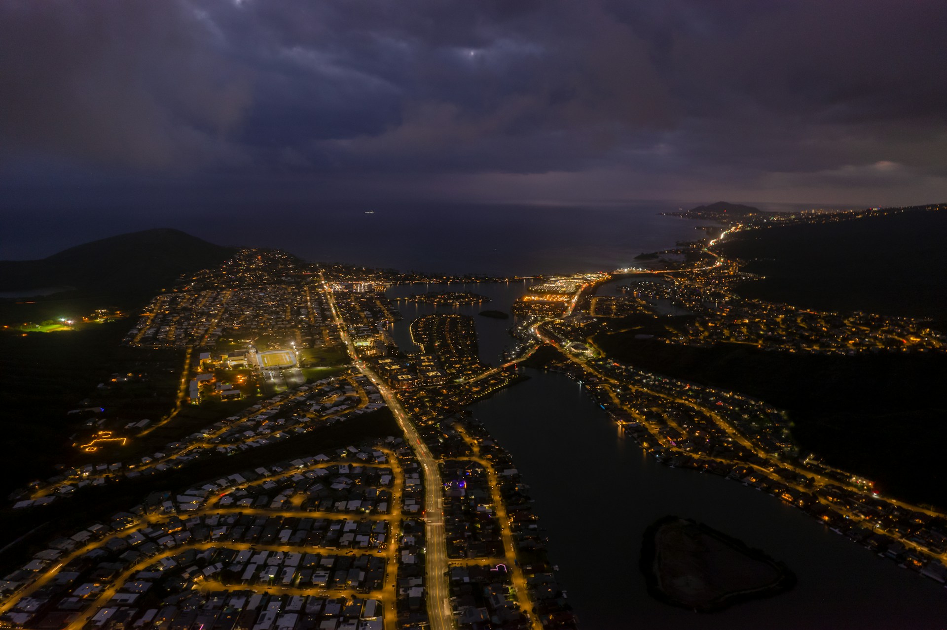 an aerial view of a city at night