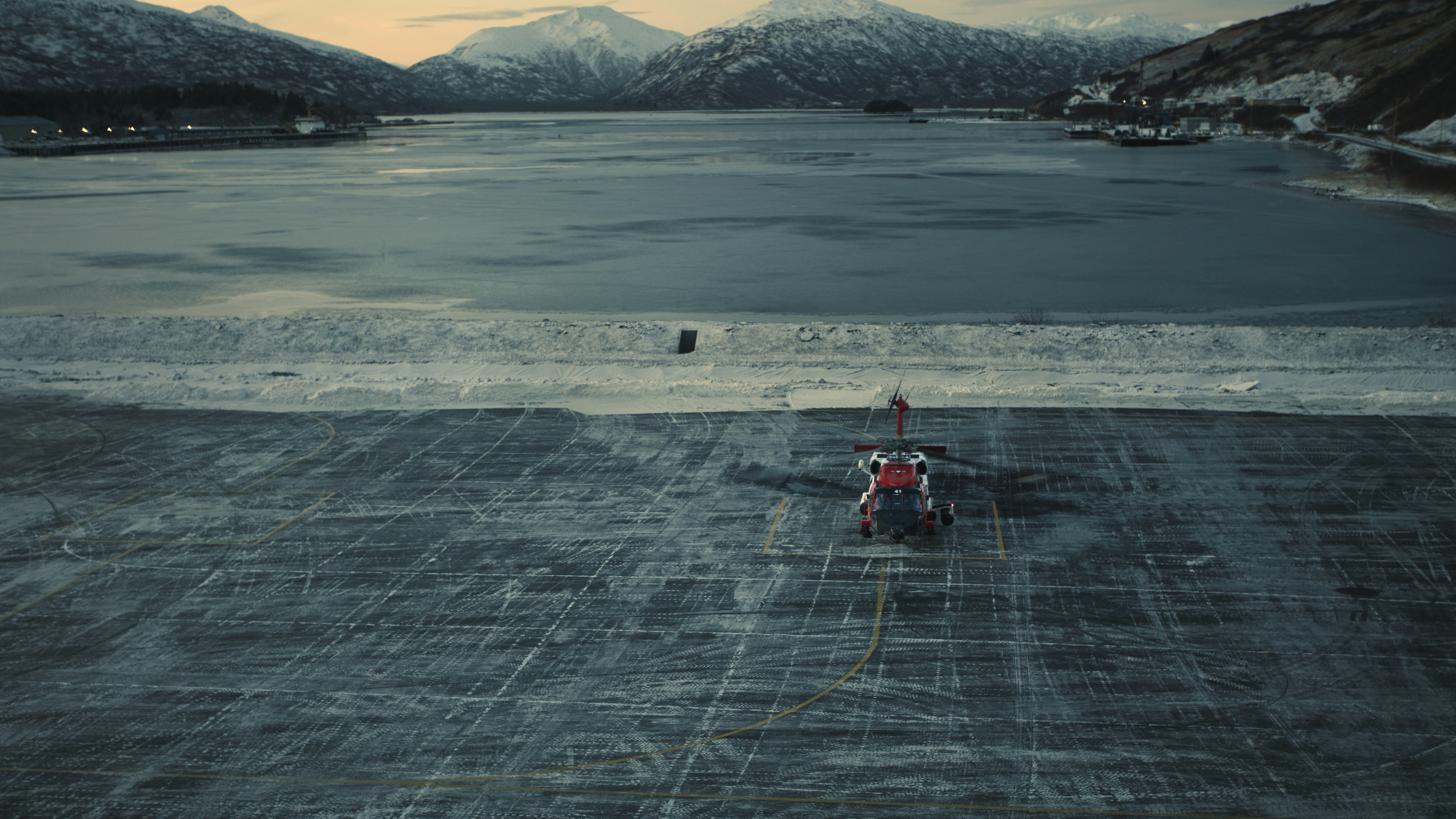 a small helicopter sitting on top of a tarmac