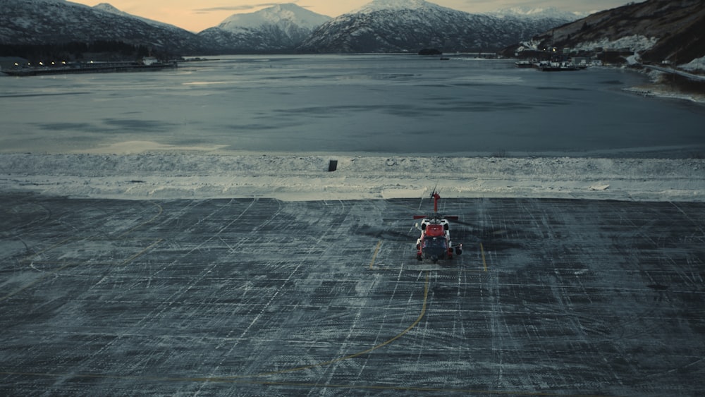a small helicopter sitting on top of a tarmac