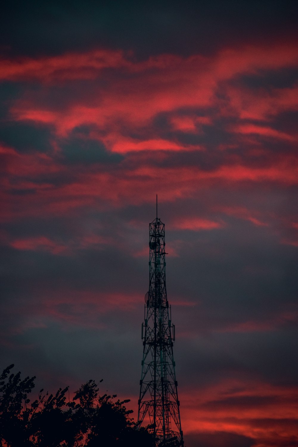 a very tall tower sitting under a cloudy sky