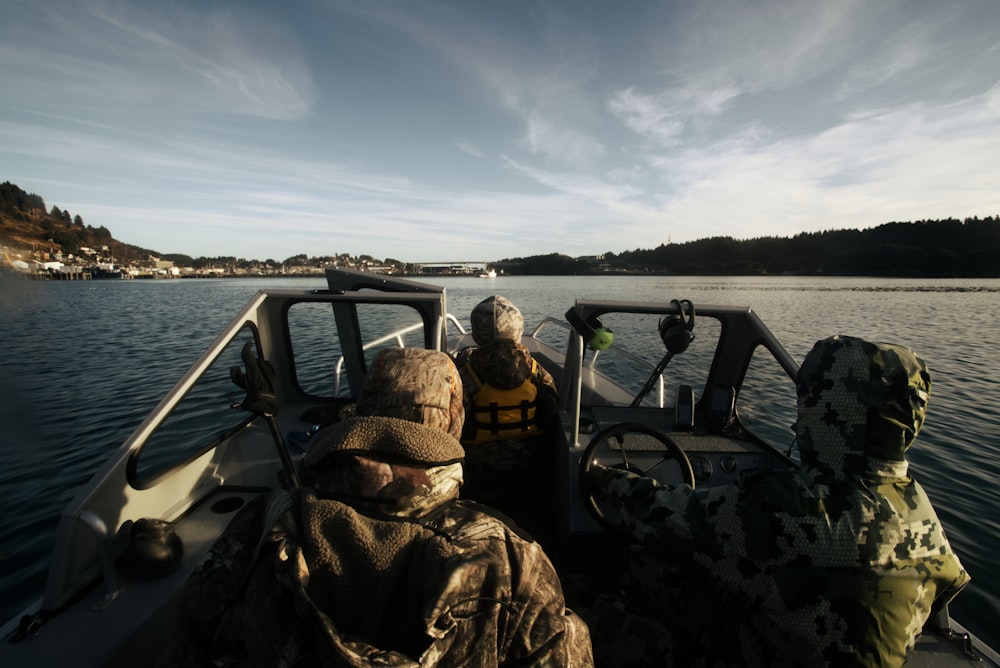 a couple of people on a boat in the water