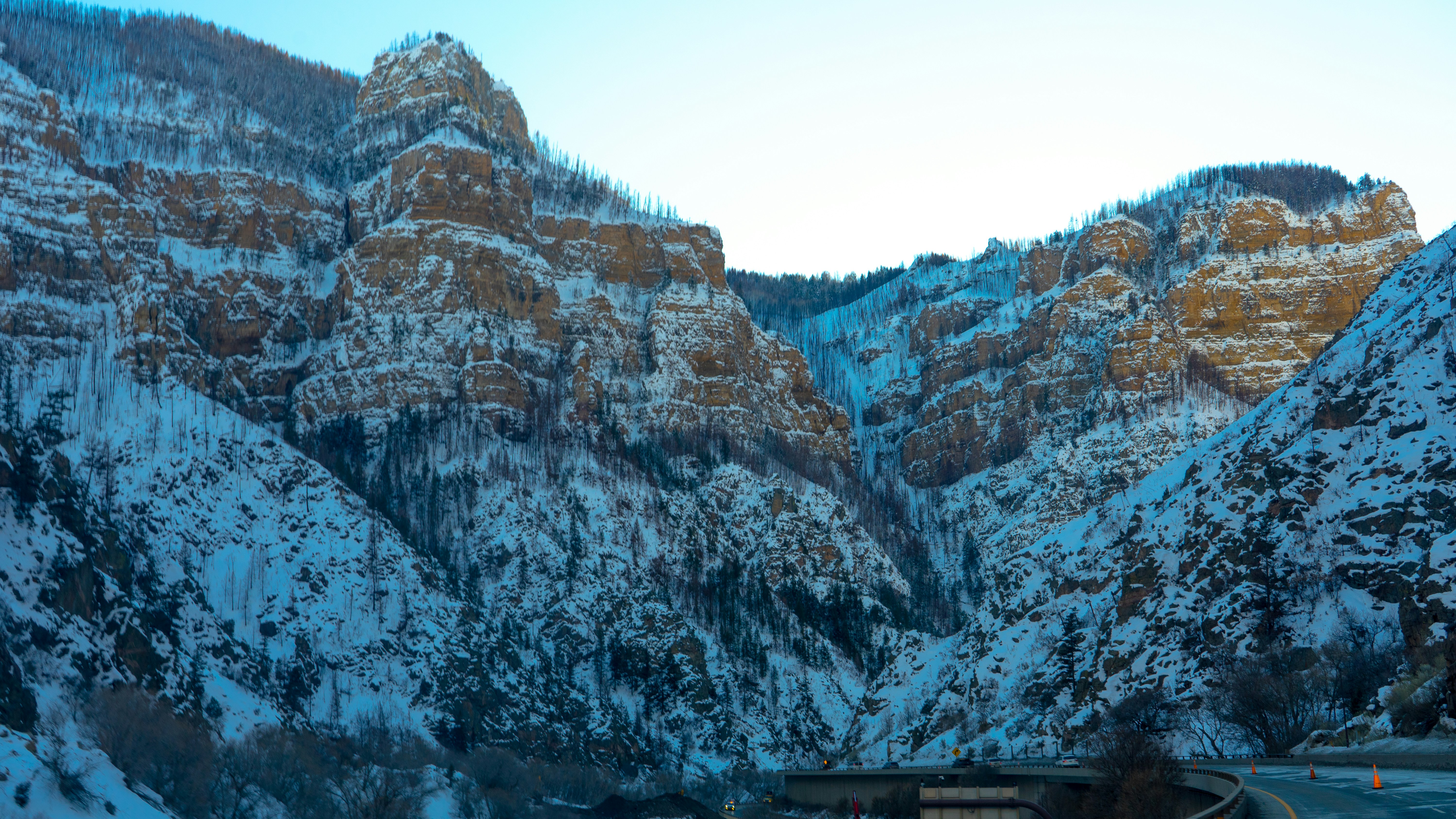 a scenic view of a mountain with snow on it