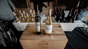 Three bottles of wine in a fancy wooden box