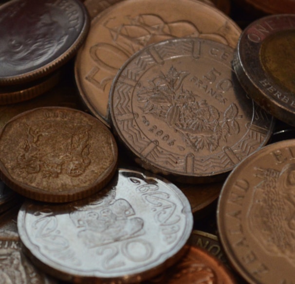 a pile of different types of coins