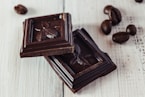 a couple of pieces of chocolate sitting on top of a table