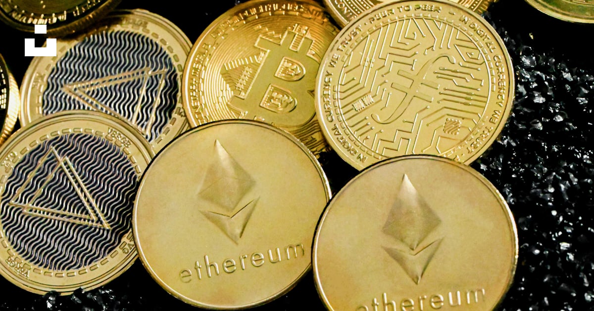 A pile of crypt coins sitting on top of a table photo – Free Coin Image ...
