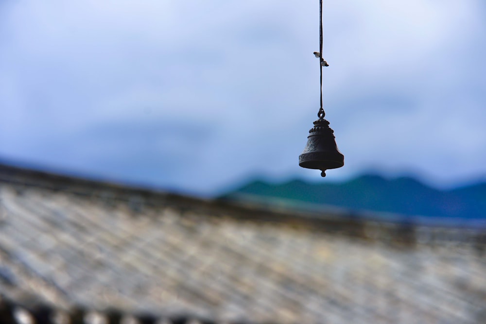 a bell hanging from the side of a building