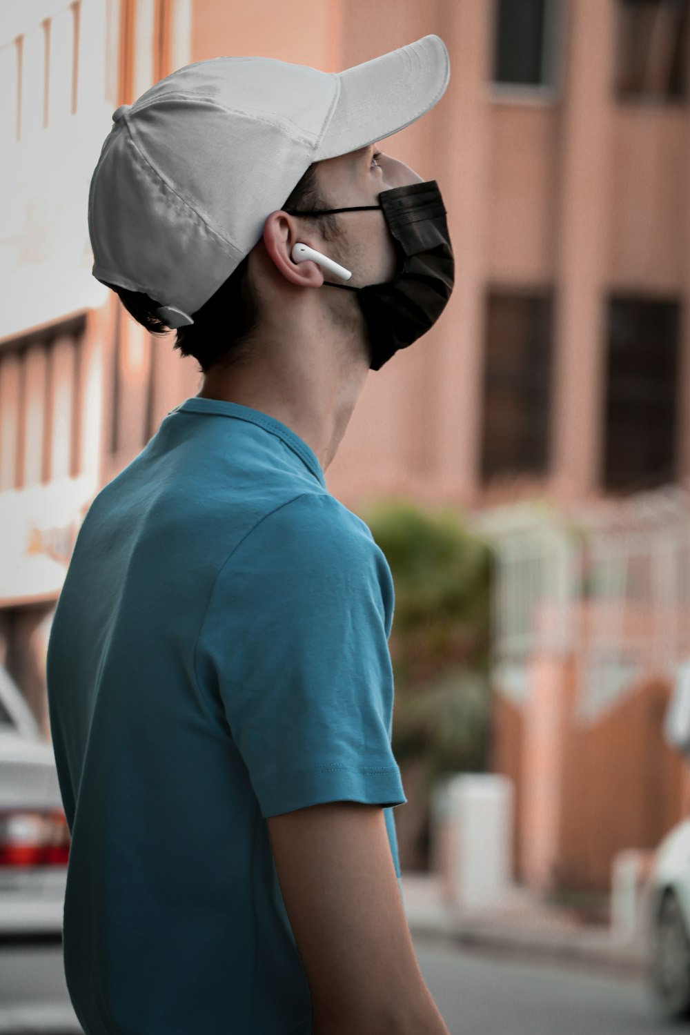 a man wearing a face mask on the street