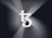 A large, stylized 'T' and 'Z' logo appears prominently in the center, with a series of gradient lines radiating outward, creating a sense of movement and depth. The background features shades of dark gray and black, enhancing the contrast with the white logo.