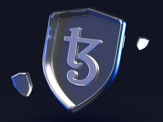A metallic shield prominently featuring a stylized symbol in the center, with smaller shield-like shapes floating around it against a dark background. The surface of the shield and surrounding elements reflect a blueish tint, giving a modern and sleek appearance.