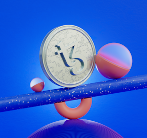 a clock and some balls on a blue surface