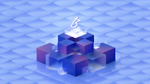 A geometric composition features a central arrangement of 3D cubes stacked in a pyramid-like structure on a gradient blue surface. At the top, a symbol resembling a currency or logo is prominent. The cubes have transparent and opaque layers in shades of blue and purple, creating a futuristic and digital aesthetic.
