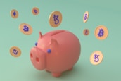 A pink piggy bank surrounded by floating digital currency coins with various cryptocurrency symbols. The background is a soft green color, and the coins feature symbols for Bitcoin, Ethereum, and Binance Coin, among others.