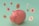 A pink piggy bank surrounded by floating digital currency coins with various cryptocurrency symbols. The background is a soft green color, and the coins feature symbols for Bitcoin, Ethereum, and Binance Coin, among others.