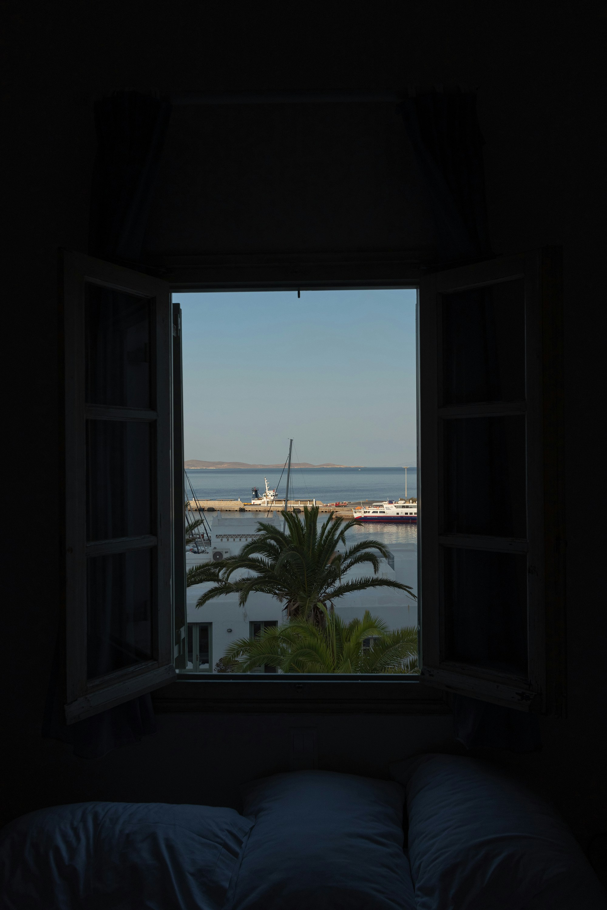 a window with a view of a body of water