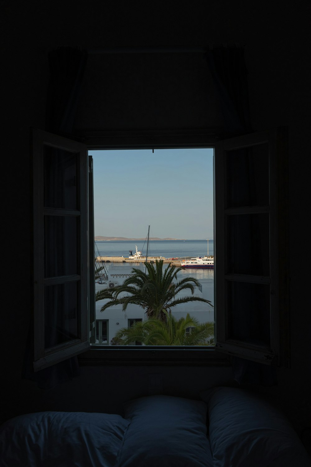 a window with a view of a body of water