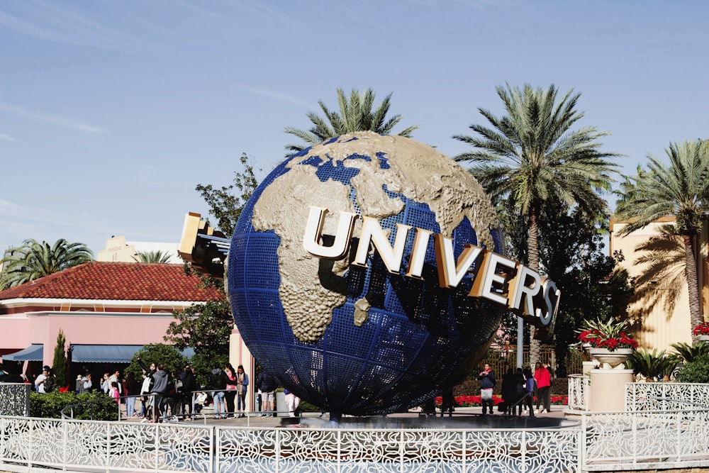 a large blue and white globe with the word universal on it