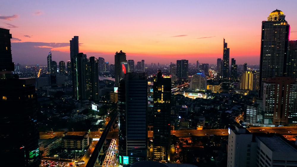 a view of a city at night from the top of a building