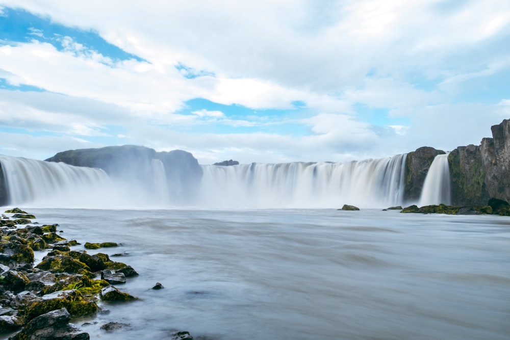 a large waterfall with water pouring out of it