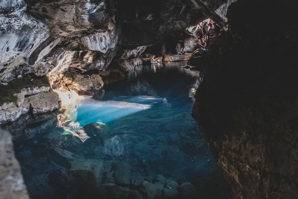 a group of people hanging out in a cave