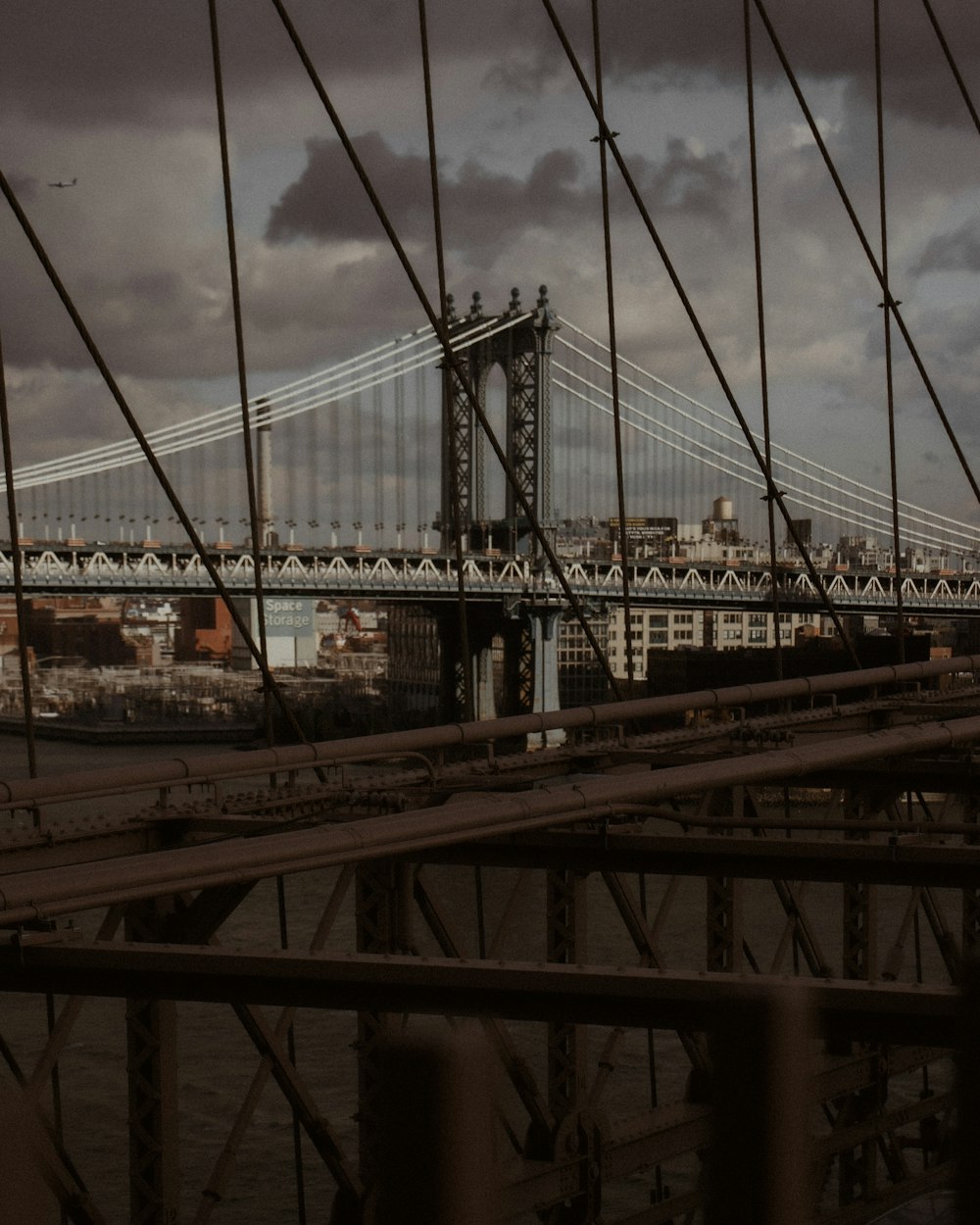 a view of a bridge from across the water