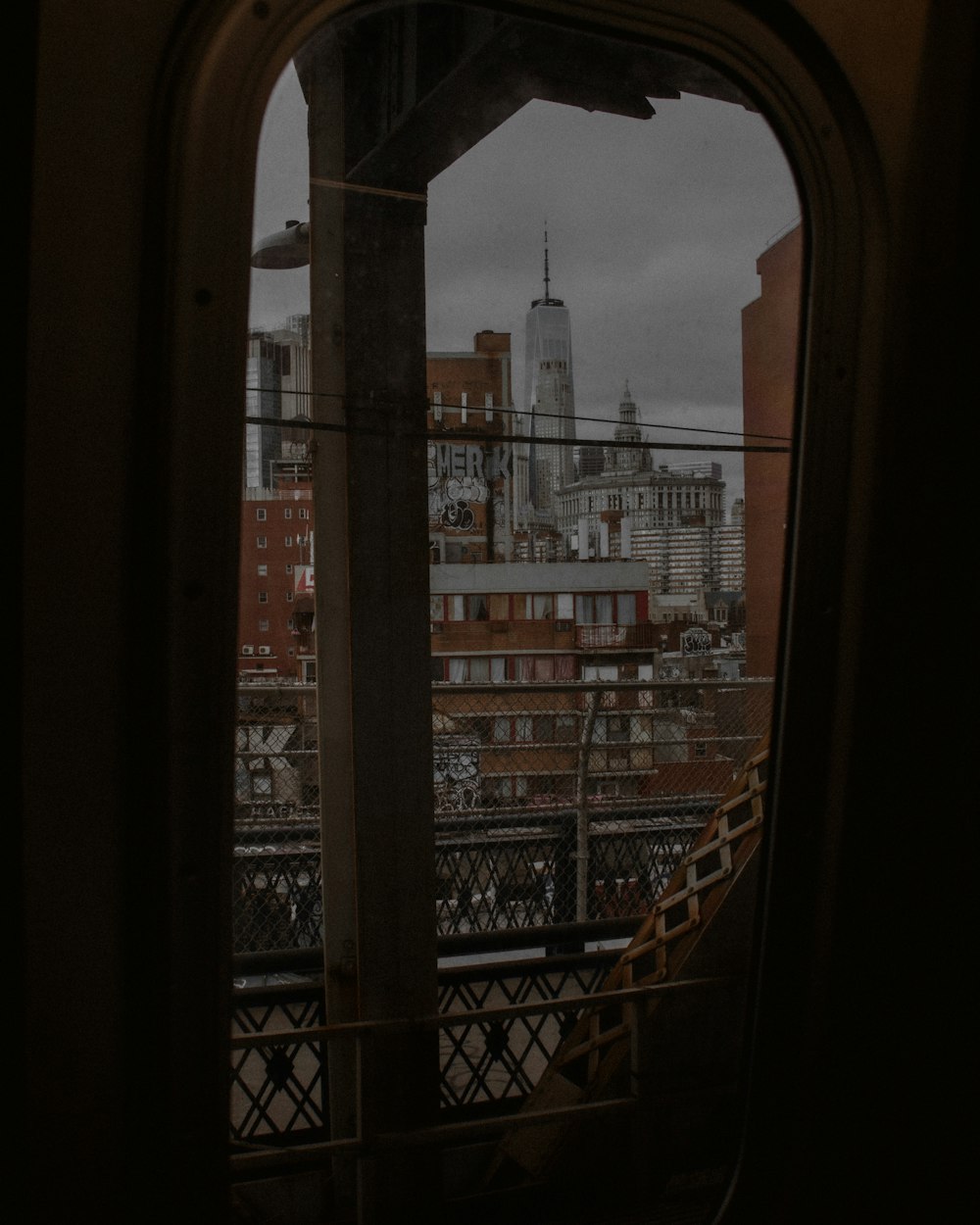 a view of a city from a train window