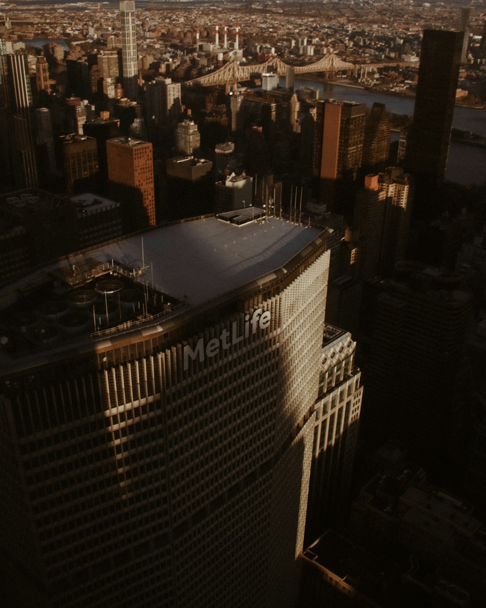 an aerial view of a city with tall buildings