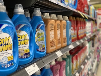 bottles of cold power on a shelf in a store
