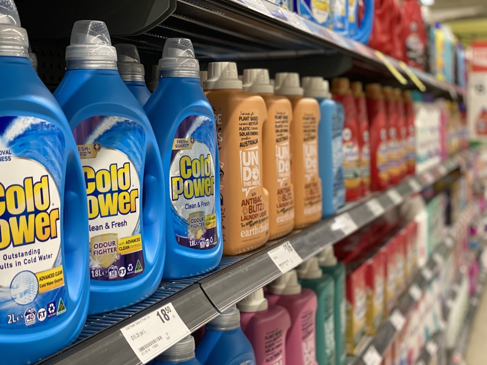 bottles of cold power on a shelf in a store