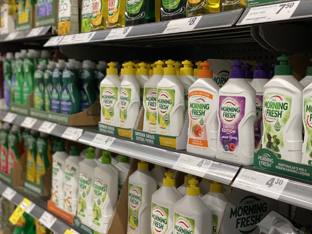 a display in a store filled with lots of bottles of cleaning products