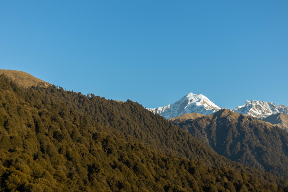 a view of a mountain range with snow on the top