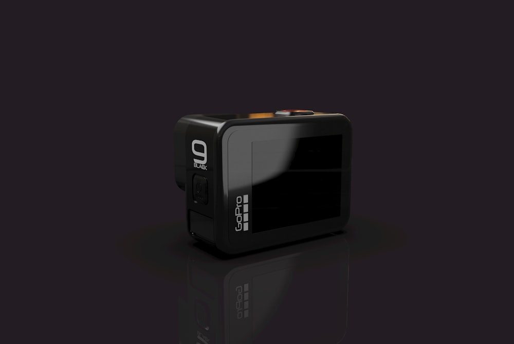 a black box camera with a black background