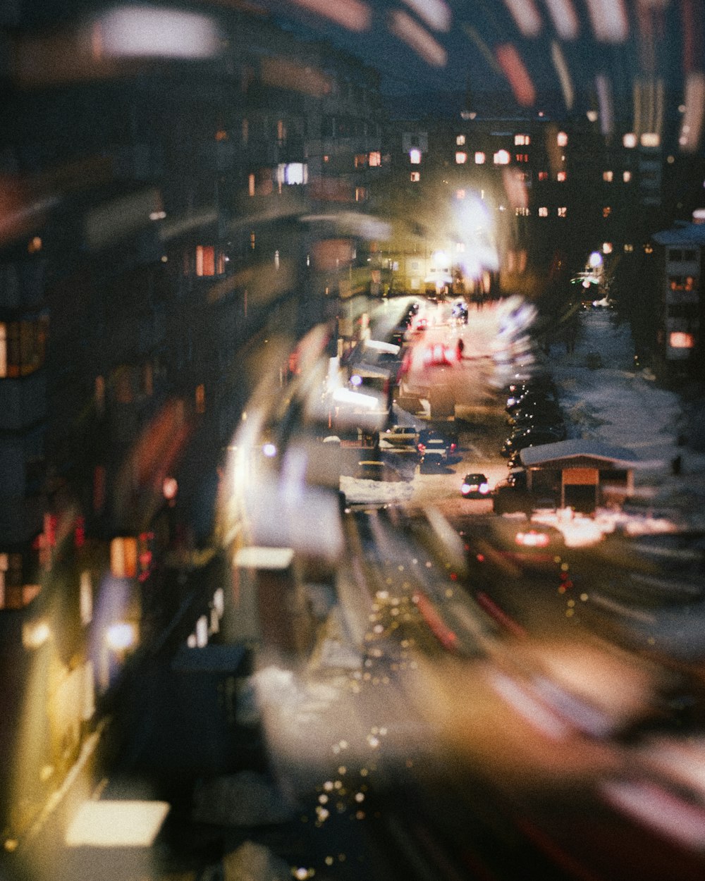 a blurry photo of a city street at night