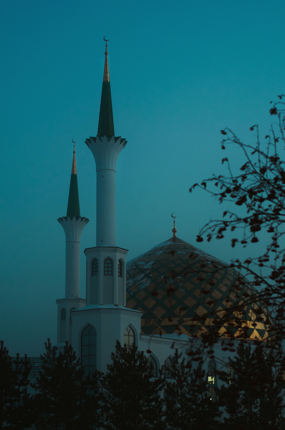 a large white building with two towers and a dome